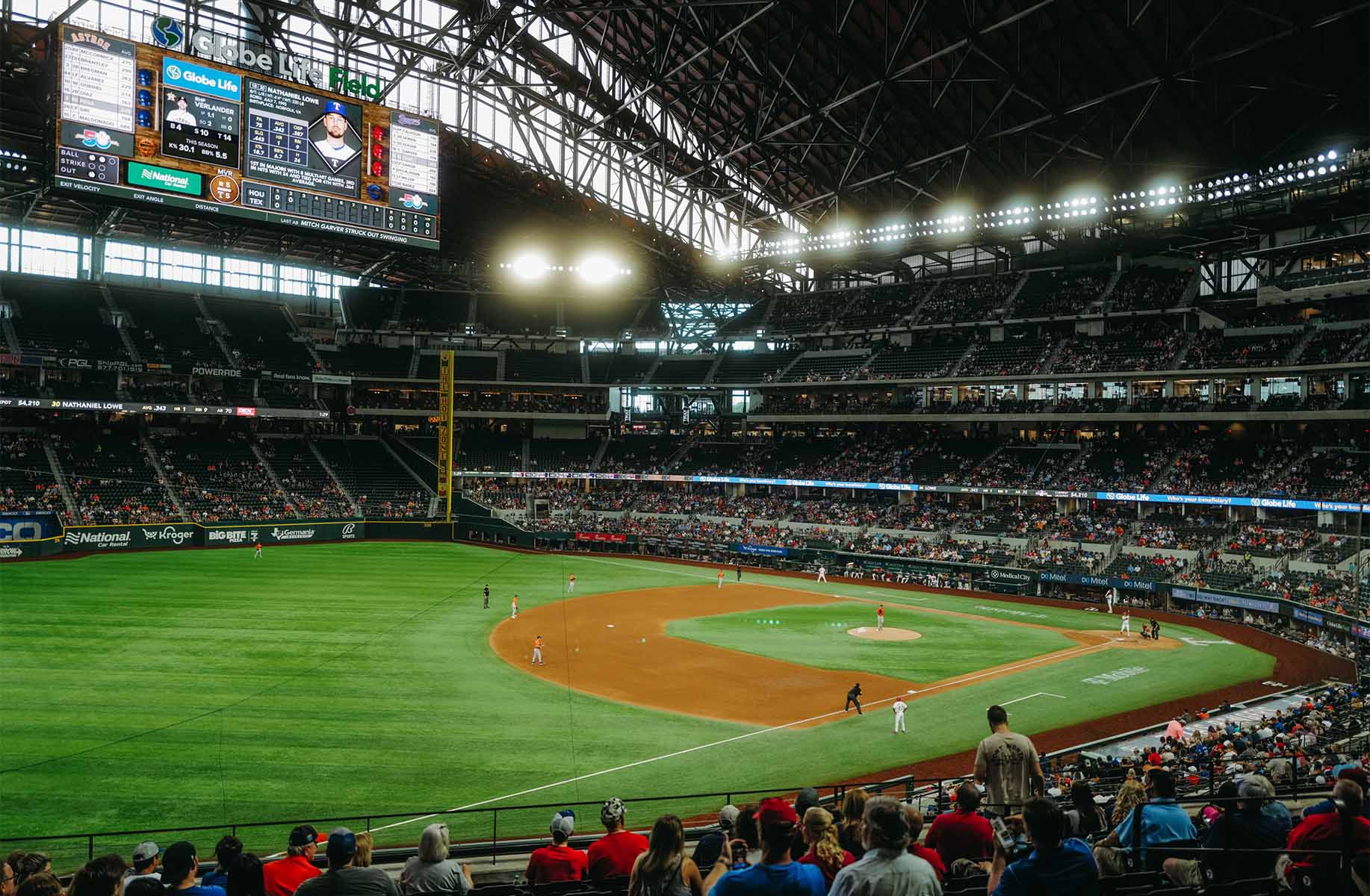 Texas Rangers stadium packed with fans during baseball game.