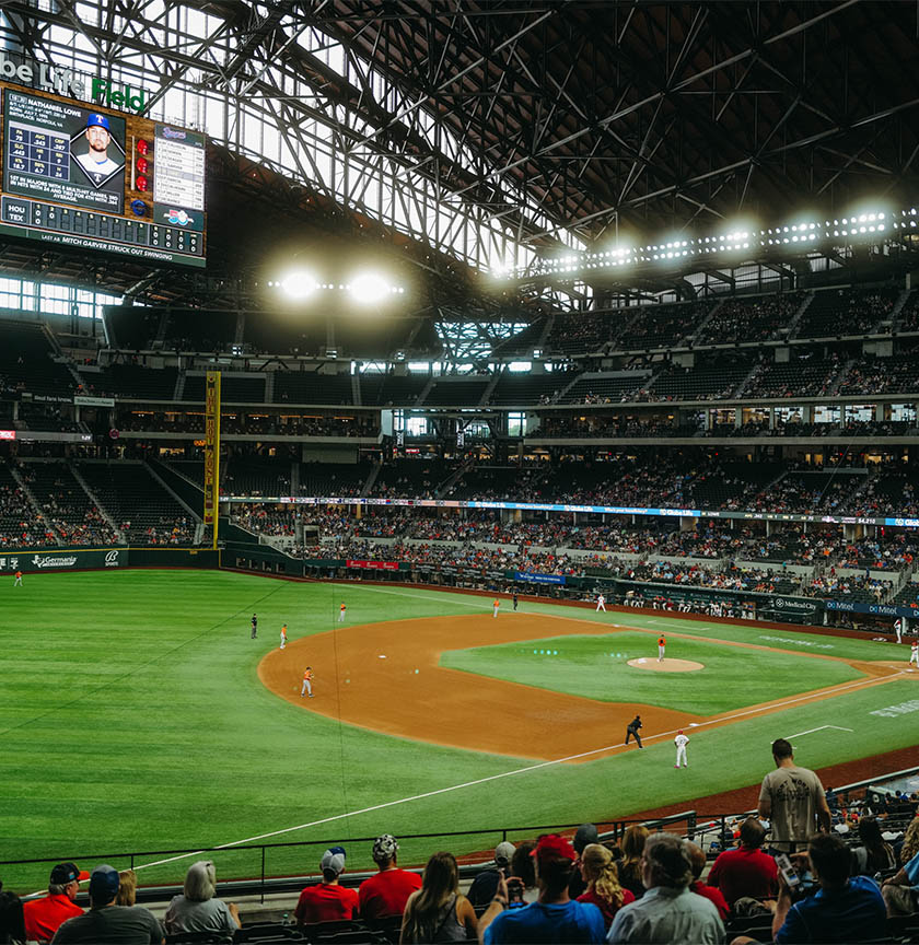 Texas Rangers stadium packed with fans during baseball game.