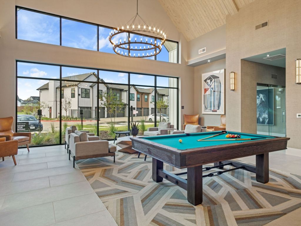 Gin Mill community lounge with plush seating and pool table.
